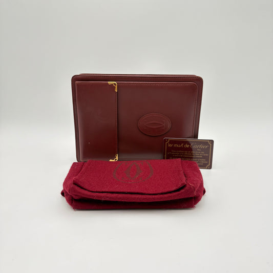 La pochette à dragonne Cartier