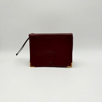 La pochette à dragonne Cartier
